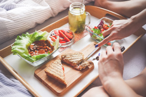 young-woman-enjoying-morning-breakfast-in-bed-2-picjumbo-com